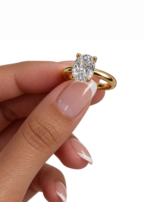 Celeste Oval Ring worn on hand as part of a stacked look